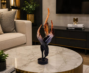 Dawood Lifestyle & Gadgets kes black and copper twisted feather sculpture featuring three abstract resin feathers with metallic copper tips on a glossy black round base for luxury home and office décor.