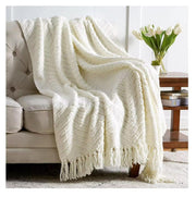 Textured knitted heavy throw blanket with tassels in white, rust, and light grey, size 