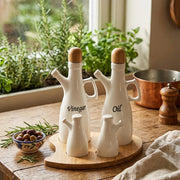5pcs porcelain condiment set with oil and vinegar bottles, salt and pepper shakers on bamboo stand.