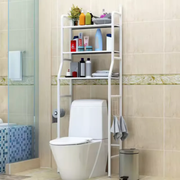 Toilet stand rack placed behind a toilet providing vertical bathroom storage shelves
