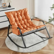 Orange tufted rocking chair with a sturdy frame for indoor and outdoor relaxation.