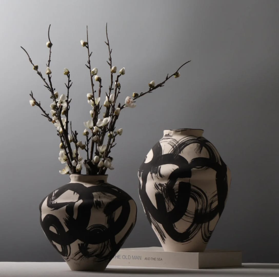 Artistic vase set of 2 pieces with bold patterns for modern statement corner home décor. 