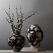 Artistic vase set of 2 pieces with bold patterns for modern statement corner home décor. 