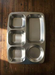 Silver stainless steel plate with five food compartments.