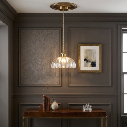 Vintage ribbed glass pendant light with brass finish and adjustable hanging cable for elegant interior lighting