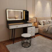 FDT 1513 black and white LED vanity dressing table with illuminated mirror, five drawers, storage shelves, and matching cushioned stool.