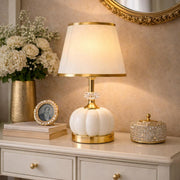 Modern crystal bedside table lamp with a gold base and fabric lampshade, ideal for bedrooms, living rooms, and desks.