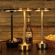 Modern rechargeable cordless LED table lamp with minimalist metal design and warm ambient lighting for home and commercial décor.