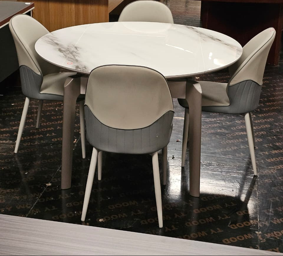 4 seater dining set with round glass top table and matching chairs for modern dining room use