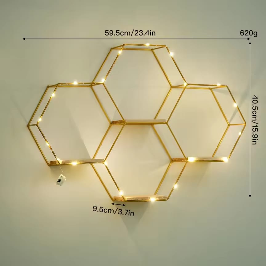 Dawood Lifestyle & Gadgets kes 4-piece gold hexagon wall shelf with natural wood bases and warm LED fairy lights in a geometric honeycomb floating design.