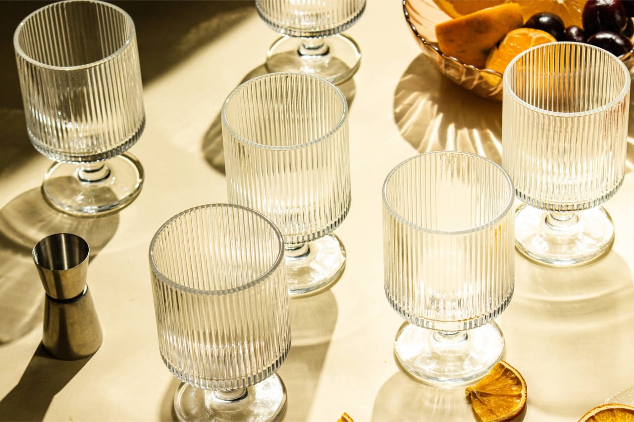 Set of six multifunctional clear glass cups with a 180 ml capacity for serving hot and cold beverages.