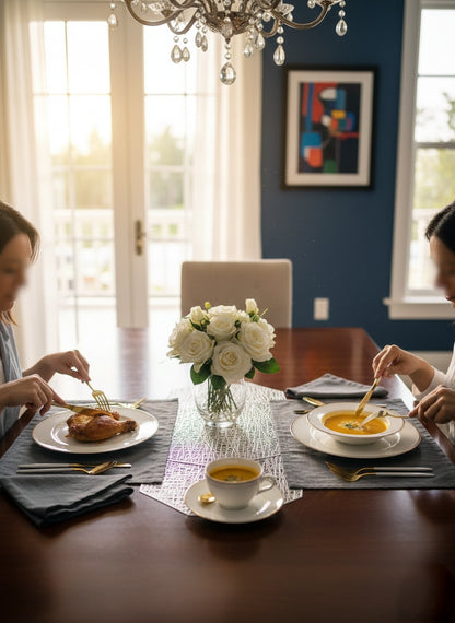 Slim 24-piece cutlery set with spoons, forks, knives, and teaspoons displayed neatly.