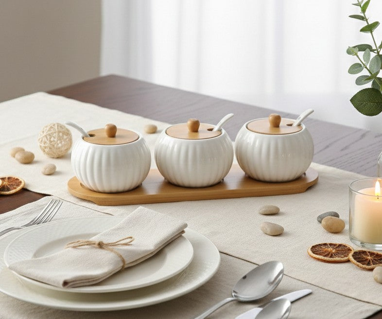Seven piece porcelain kitchen canister set with matching bamboo tray for organized countertop storage