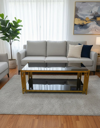 Black tempered-glass coffee table with gold steel frame.
