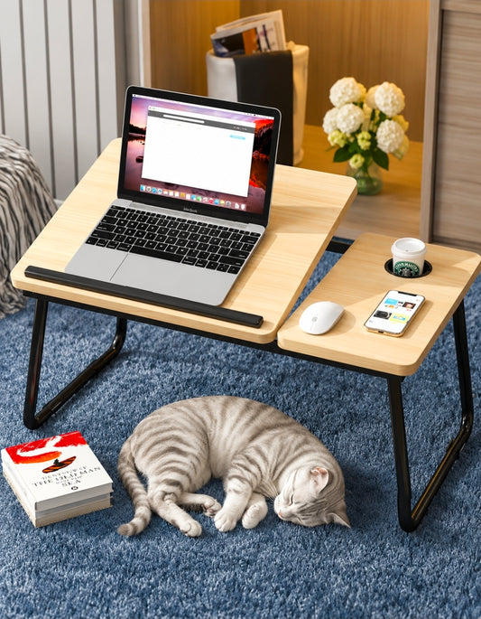 Adjustable laptop table with foldable legs for comfortable use on beds, sofas, and floors.