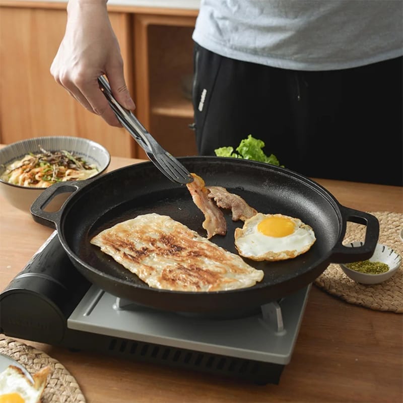 33 cm pre seasoned cast iron skillet griddle pan with naturally non stick surface for gas, electric, ceramic, induction, oven, and open fire cooking.