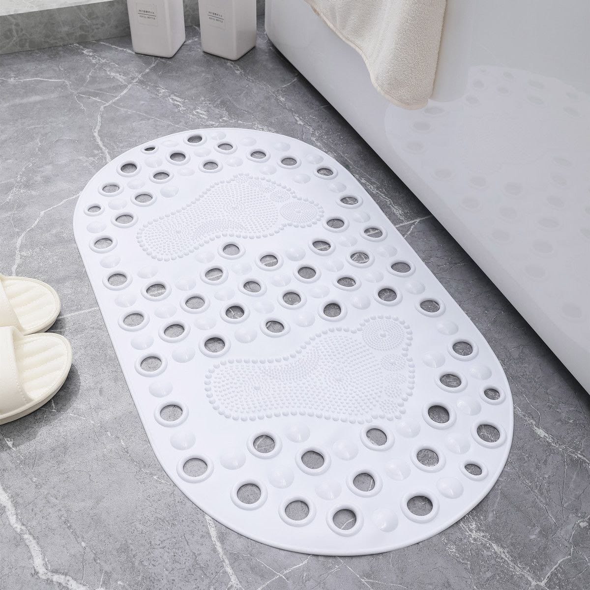 Anti-slip bathroom mat with footprint design, available in grey, white, and beige