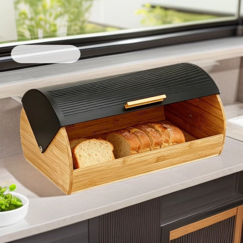 Bamboo bread box with black roll top lid for storing bread and baked goods while keeping the kitchen counter neat and organized.
