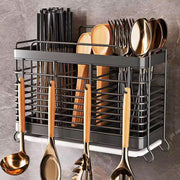 Wall-mounted stainless steel cutlery and knife storage rack.