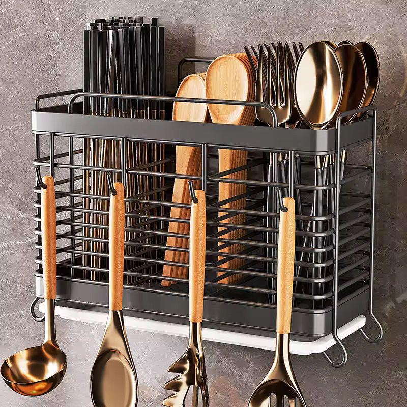 Wall-mounted stainless steel cutlery and knife storage rack.
