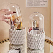 White 360° rotating multifunctional holder with compartments for makeup brushes and stationery.