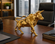 Dawood Lifestyle & Gadgets kes golden charging bull sculpture with mirror gold finish, detailed muscular body and dynamic forward stance, ideal for executive office and luxury décor displays.