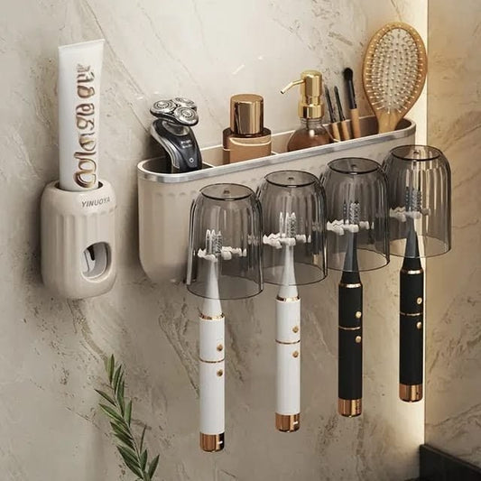 Toothbrush organizer with automatic toothpaste dispenser and cups mounted on bathroom wall
