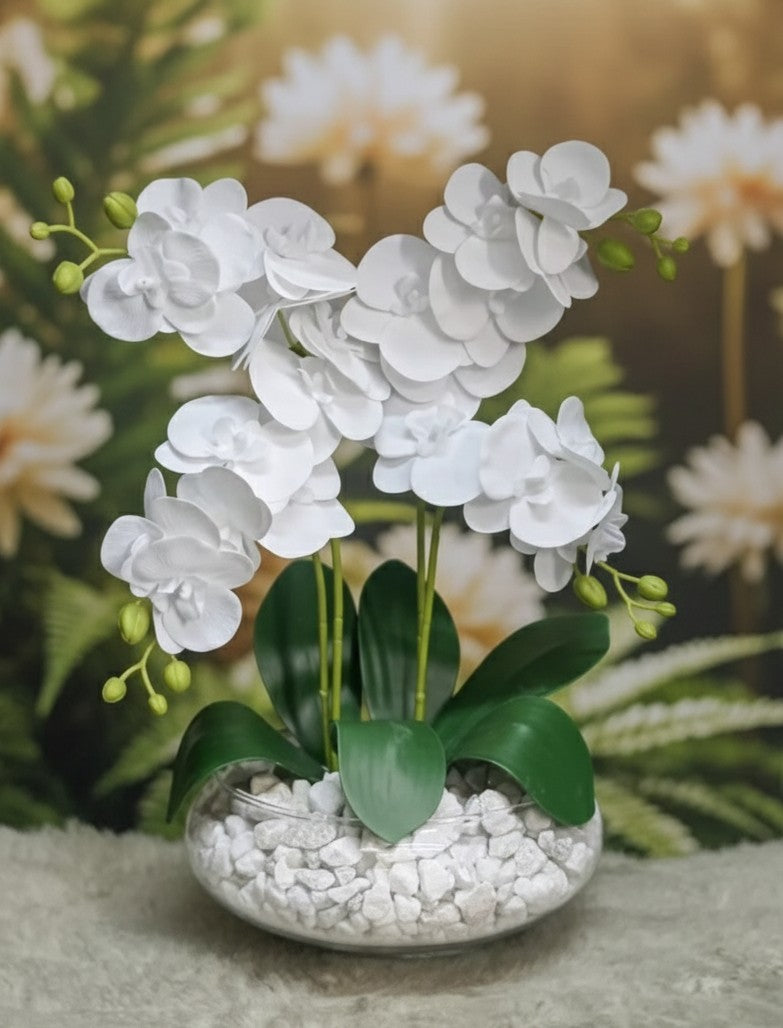 Glass vase with artificial orchid flowers displayed for home décor