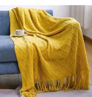 Knitted throw blanket for sofa and bed use providing warmth, comfort, and modern home décor style