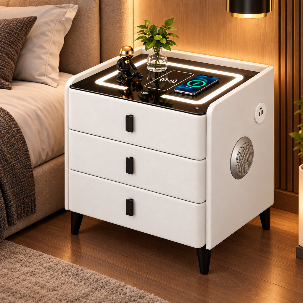 White smart bedside table measuring 60 × 40 × 50 cm with wireless charging, USB port, three color LED lighting, Bluetooth speaker, and three drawers.