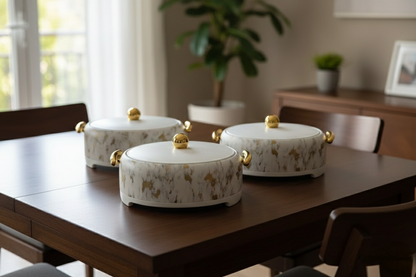 Three-piece marble pattern insulated hotpots with gold finish for keeping food warm.
