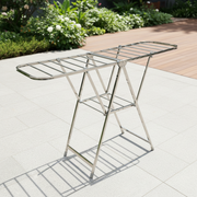 Capsule design outdoor drying rack with stable frame structure ideal for efficient household laundry drying in compact spaces.