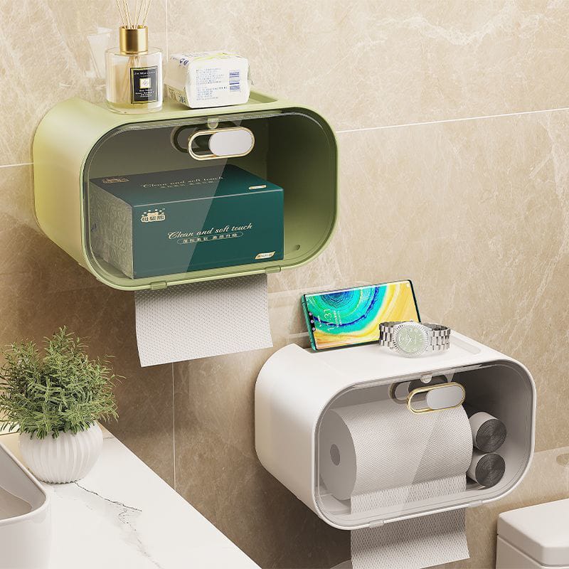 White wall mounted tissue box with gold plated finish and storage tray.