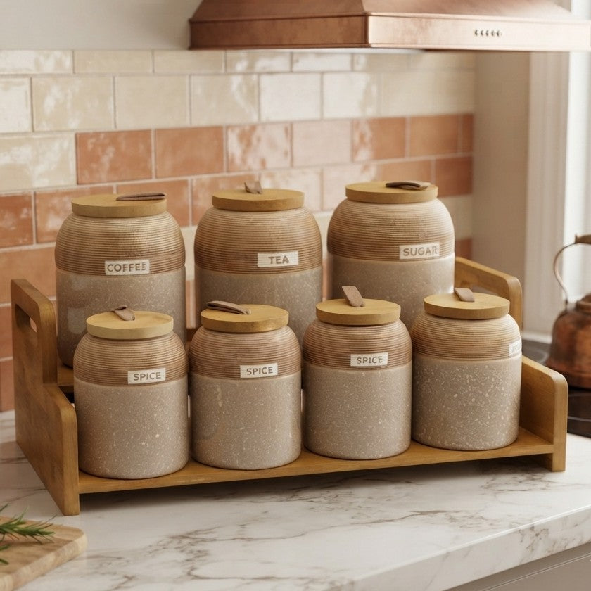 7 piece speckled ceramic spice jar set with wooden lids, leather loop handles, and a wooden display tray for stylish kitchen storage.