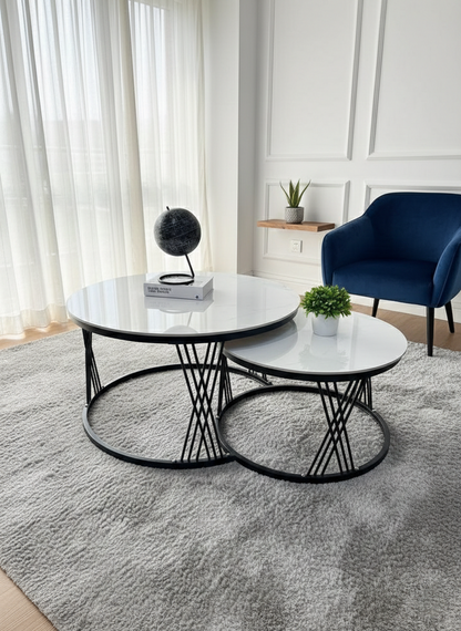 Set of 2 nesting tables with pure marble tops and durable frame.