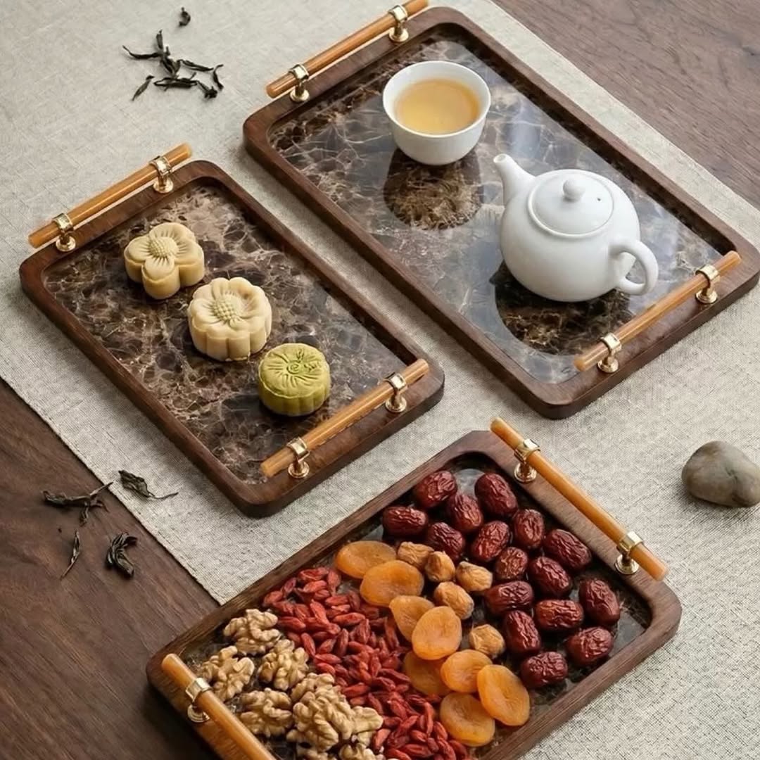 Three piece bamboo nesting serving tray set with grey handles and raised edges for serving, organizing, and home décor.