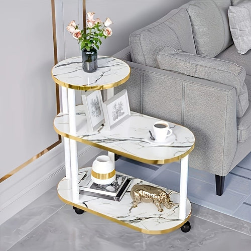 Three layer trolley rack table with oval round top design in black and white marble finish measuring 60×30×67 cm.