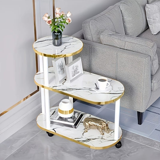 Three layer trolley rack table with oval round top design in black and white marble finish measuring 60×30×67 cm.