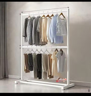 Floor-standing clothes rack with hooks and shelves for organizing coats, shoes, and accessories.
