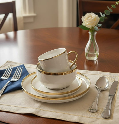White and gold 24-piece stackable dinner set with plates, bowls, and cups.