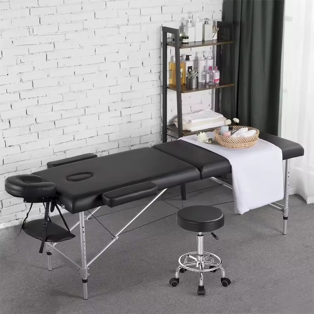 Foldable steel frame massage and lash bed with carrying case and facial cradle.