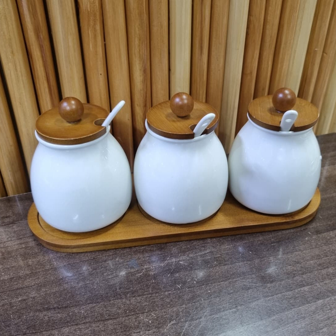 3 piece 480 ml ceramic canister set with bamboo base and scoop for organized kitchen and pantry storage.