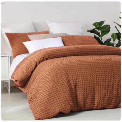 Waffle-textured bed coverlet set with two pillowcases in multiple colors.