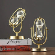 Metal 1 hour hourglass sand timer with clear glass chambers and reusable rotating design.