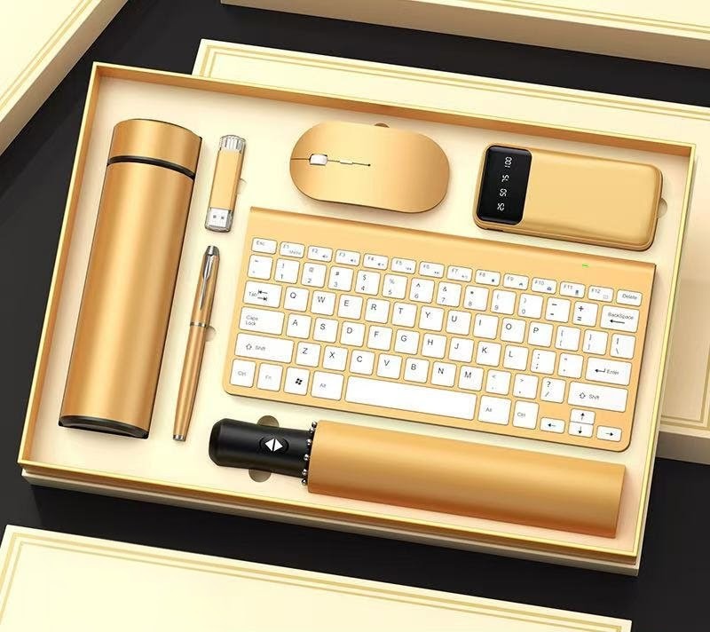 High end business gift set with wireless keyboard, mouse, power bank, thermal cup, and accessories in gold and black