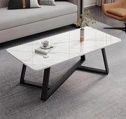 White marble top coffee table with a sleek black metal frame for modern living room décor.