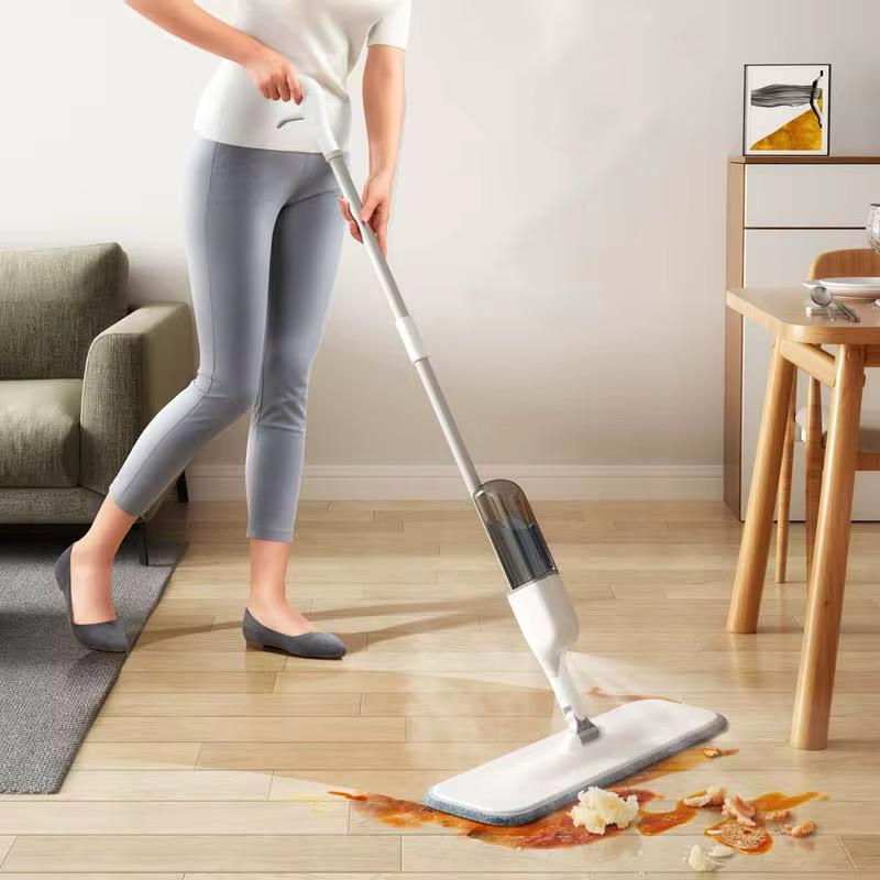Wet and dry water spray mop with refillable bottle and fan-shaped spray system.