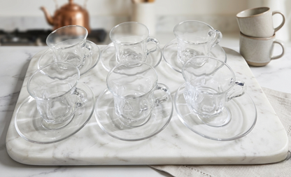 Clear glass cup with matching saucer for tea or coffee