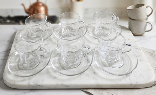 Clear glass cup with matching saucer for tea or coffee