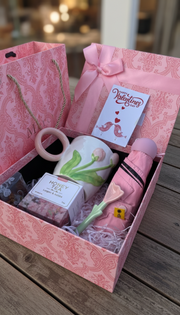 Valentines ladies gift set with floral mug, spoon, umbrella, honey tea bags, and gift bag.